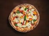 Mexicana — Sauce tomate, mozzarella, courgette, poivron, ananas, maïs, olives, champignons, piment frais, Tasty Panino Triolet